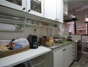 Standard Apartment, 2 Bedrooms | Private kitchen | Fridge, microwave, coffee/tea maker - GoHouse Dulcidio 307 (Rio de Janeiro)