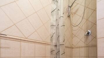 A bathroom with a sink, shower, and bathtub.