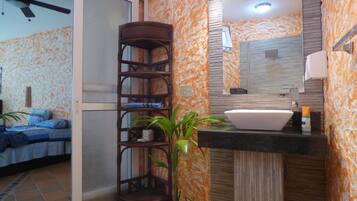 Apartment, 1 Double Bed | Bathroom | Shower, rainfall showerhead, free toiletries, towels
