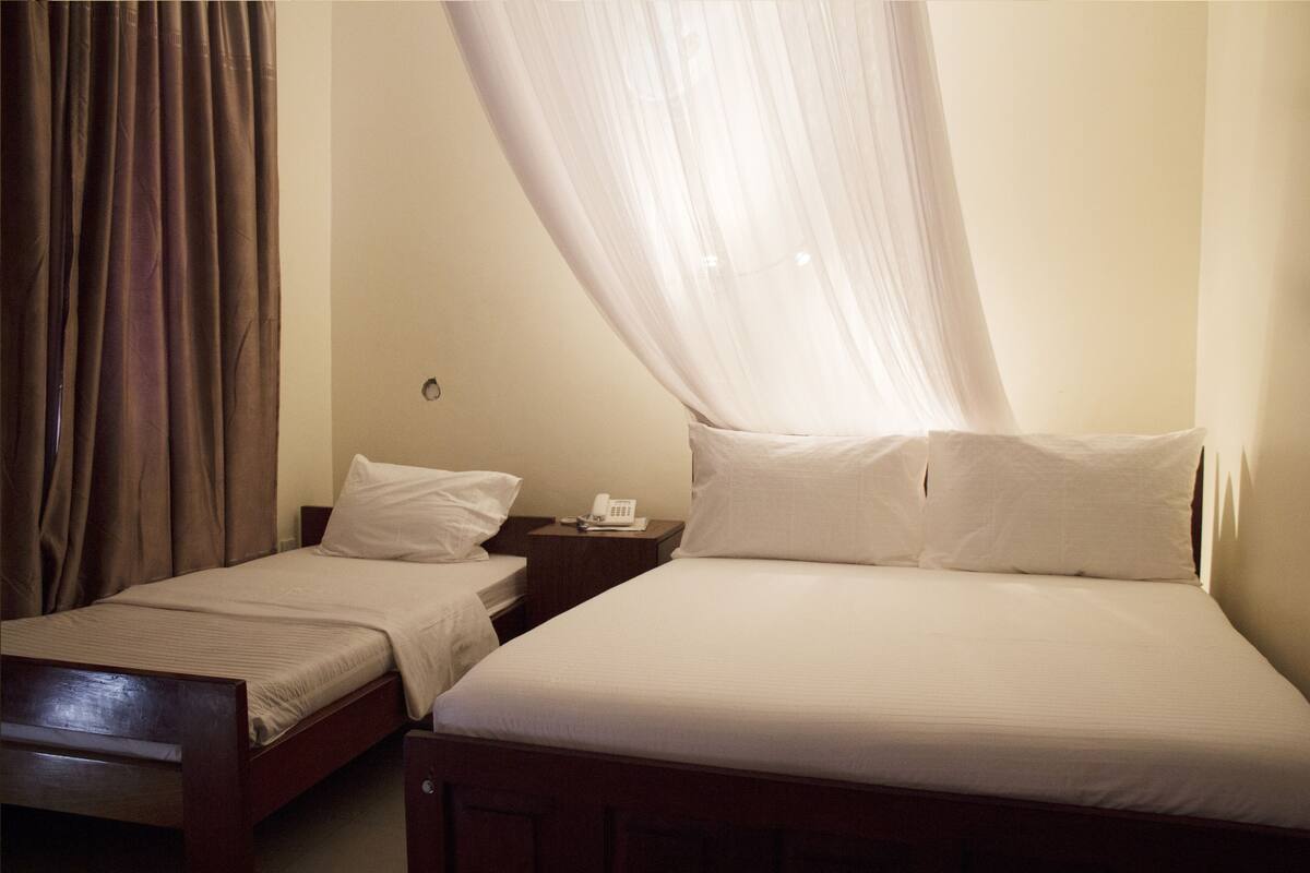 Family Room | Minibar, in-room safe, desk, WiFi (free)