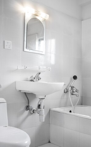 Deluxe Quadruple Room | Bathroom | Shower, free toiletries, hair dryer, towels - Hotel Mantra Inn (Pokhara)