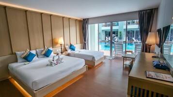 Deluxe Triple Room, Pool Access | Minibar, in-room safe, desk, blackout curtains