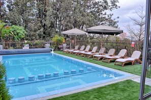 Outdoor pool, pool umbrellas, pool loungers