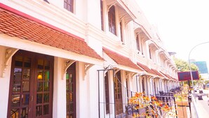 A row of white buildings with red-tiled roofs and large windows. - Hotel Nippon Colombo (Colombo)