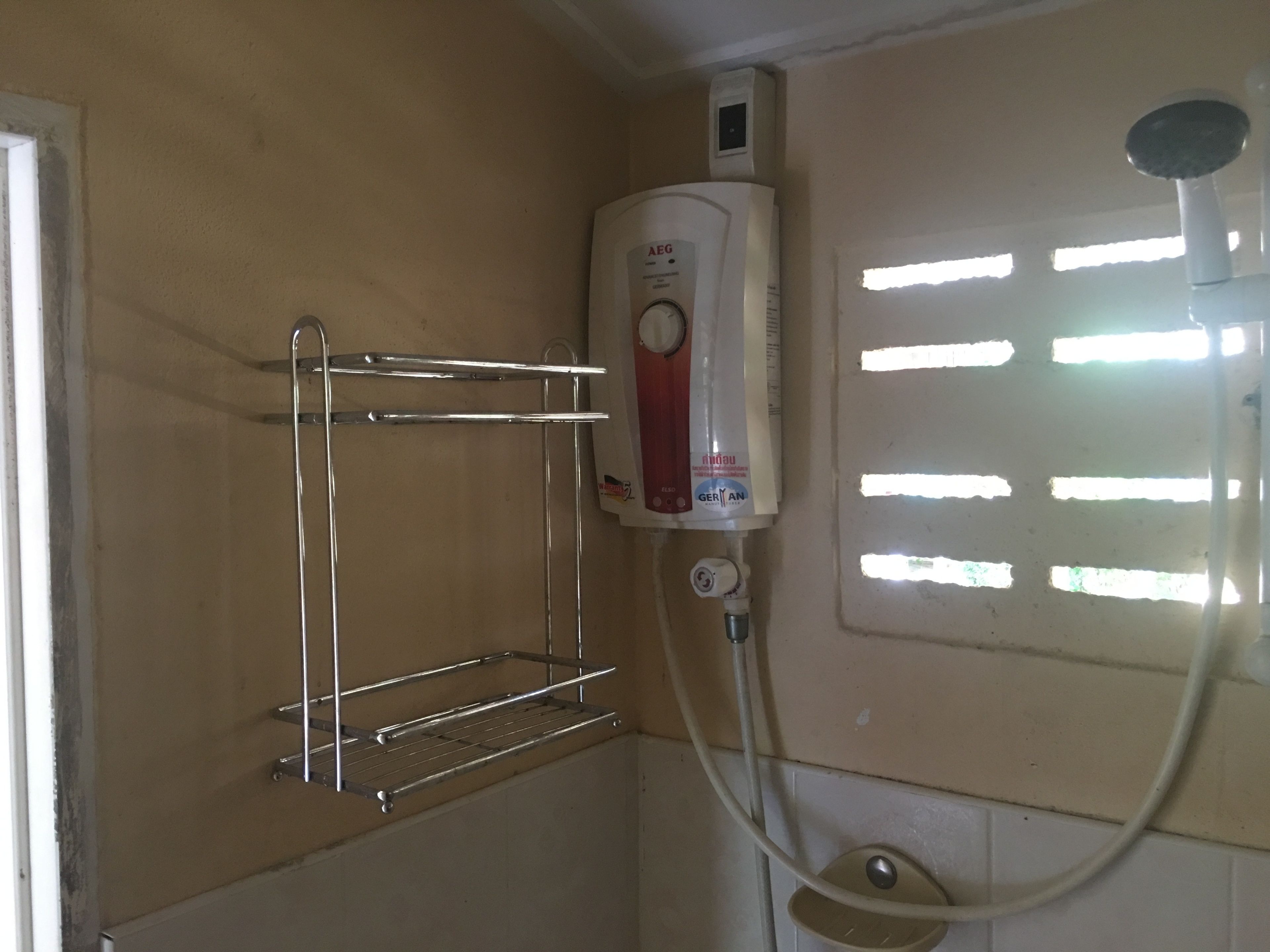 bungalow with air conditioner | bathroom | shower, rainfall showerhead, towels, soap