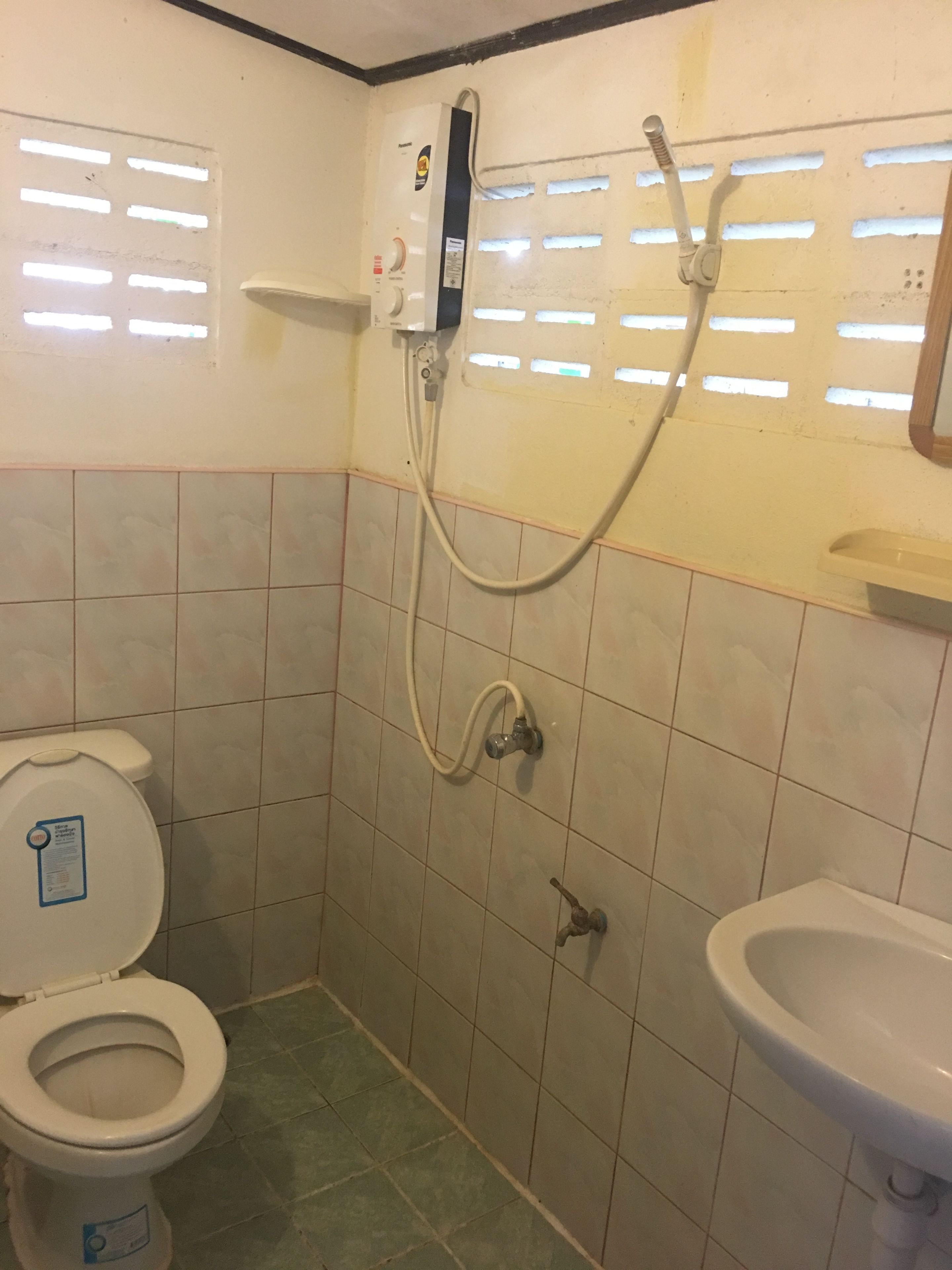 beach front bungalow | bathroom | shower, rainfall showerhead, towels, soap