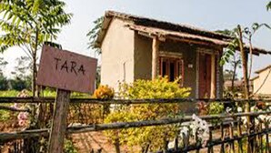 A small, rustic house with a sign that reads "TARA" in front of it. - Barauli Community Homestay (Kawasoti)