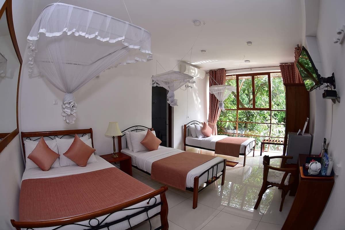 Family Room, Multiple Beds, Private Bathroom | Egyptian cotton sheets, premium bedding, in-room safe, desk
