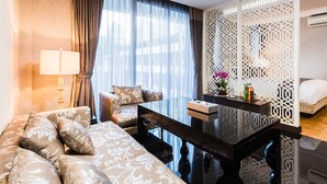 Penthouse Suite King bed | Living area | 32-inch LED TV with satellite channels, TV - the FAH silom (Bangkok)