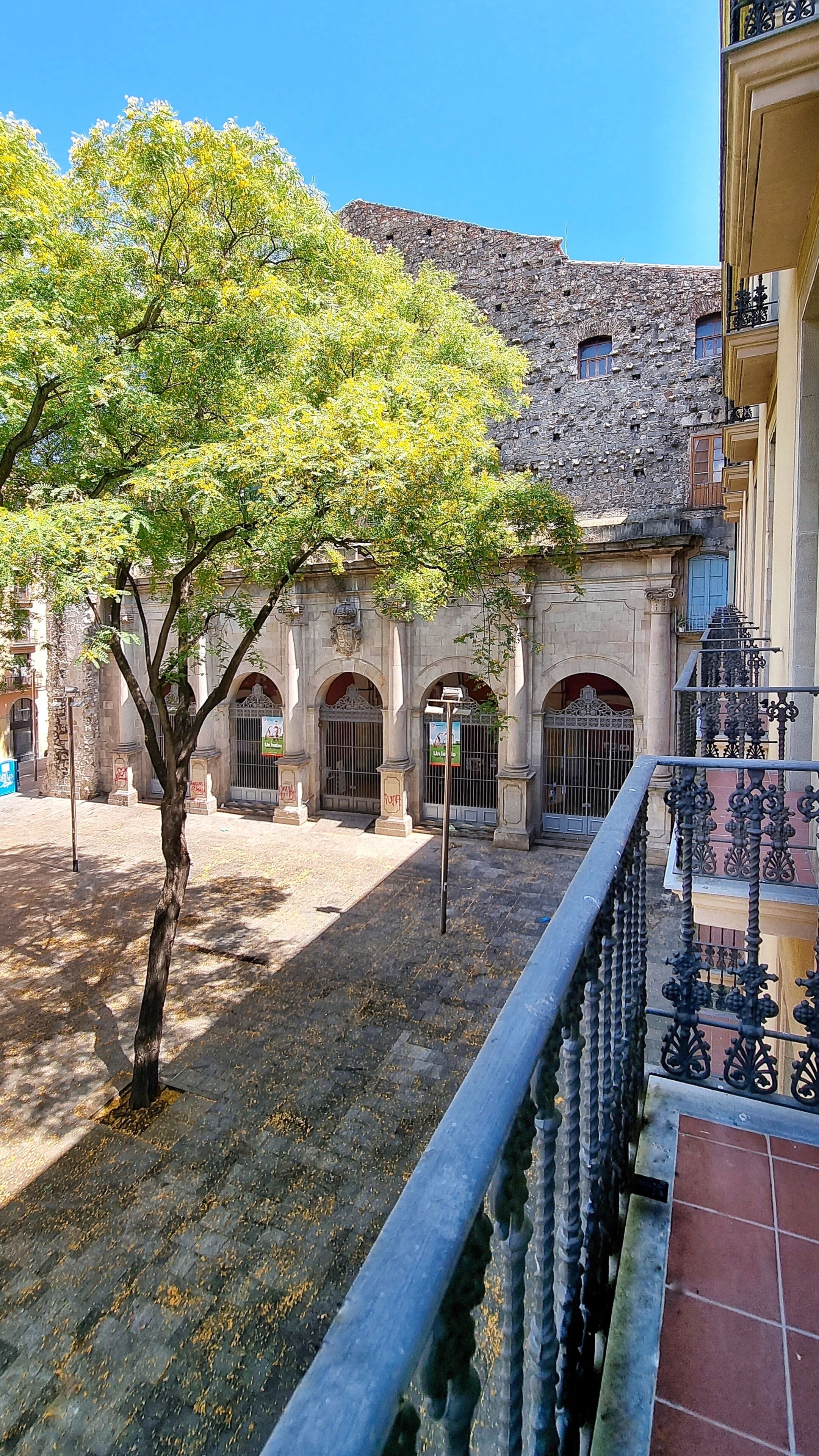 double exterior comfort room with square/street view | in-room safe, desk, laptop workspace, blackout curtains