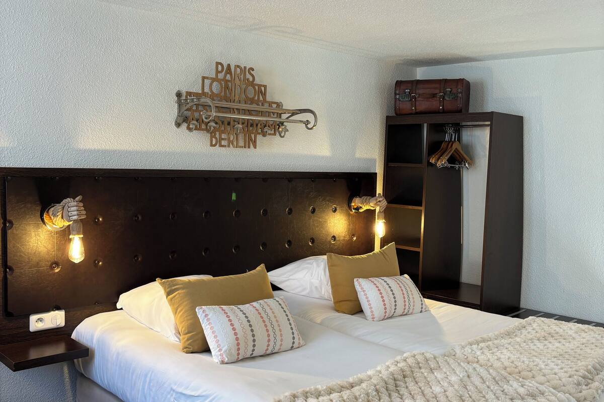 Premium bedding, pillow-top beds, desk, laptop workspace