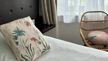 Premium bedding, pillow-top beds, desk, laptop workspace