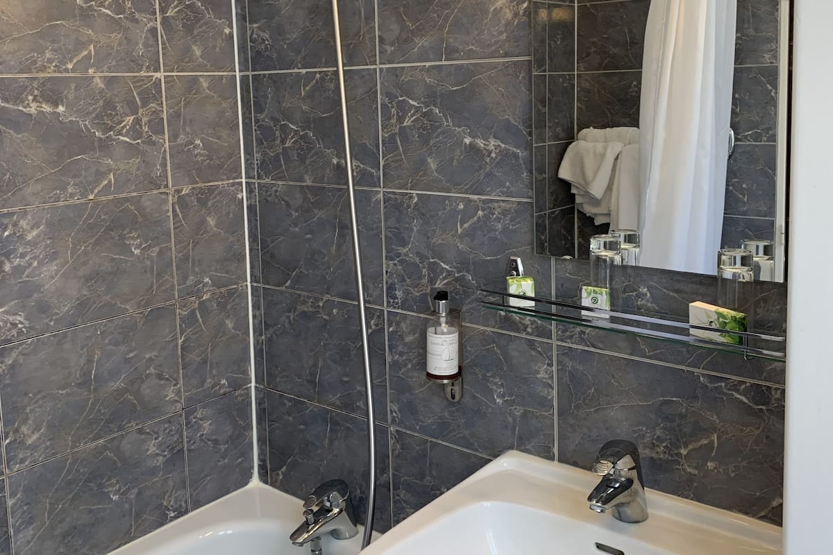 comfort twin room | bathroom | eco-friendly toiletries, hair dryer, towels, soap