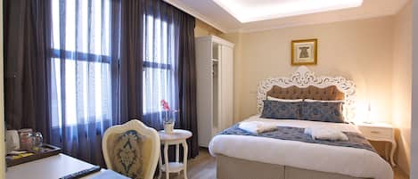 Double Room, City View | Minibar, in-room safe, desk, iron/ironing board