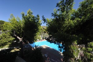 Outdoor pool, open 11 AM to 7 PM, pool umbrellas, sun loungers