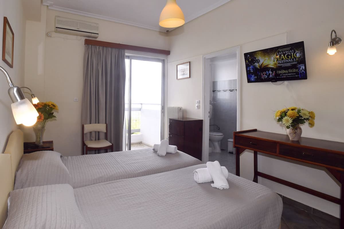 Twin kamer, uitzicht op zee | Verduisterende gordijnen, gratis wifi, beddengoed