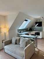 Apartment | Living area | Flat-screen TV, video-game console, DVD player