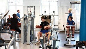 A gym with various exercise equipment, including treadmills and weight machines. - Hotell Sport & Rest (Pitea)