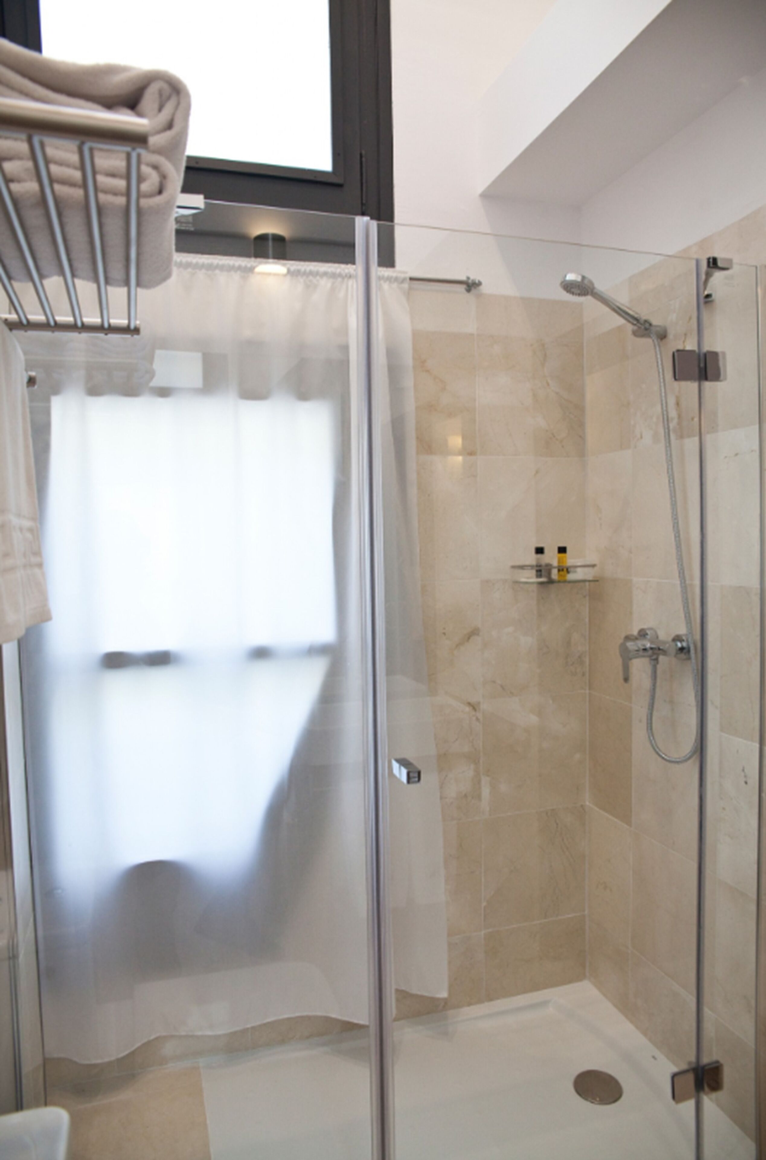 shower, free toiletries, hair dryer, towels