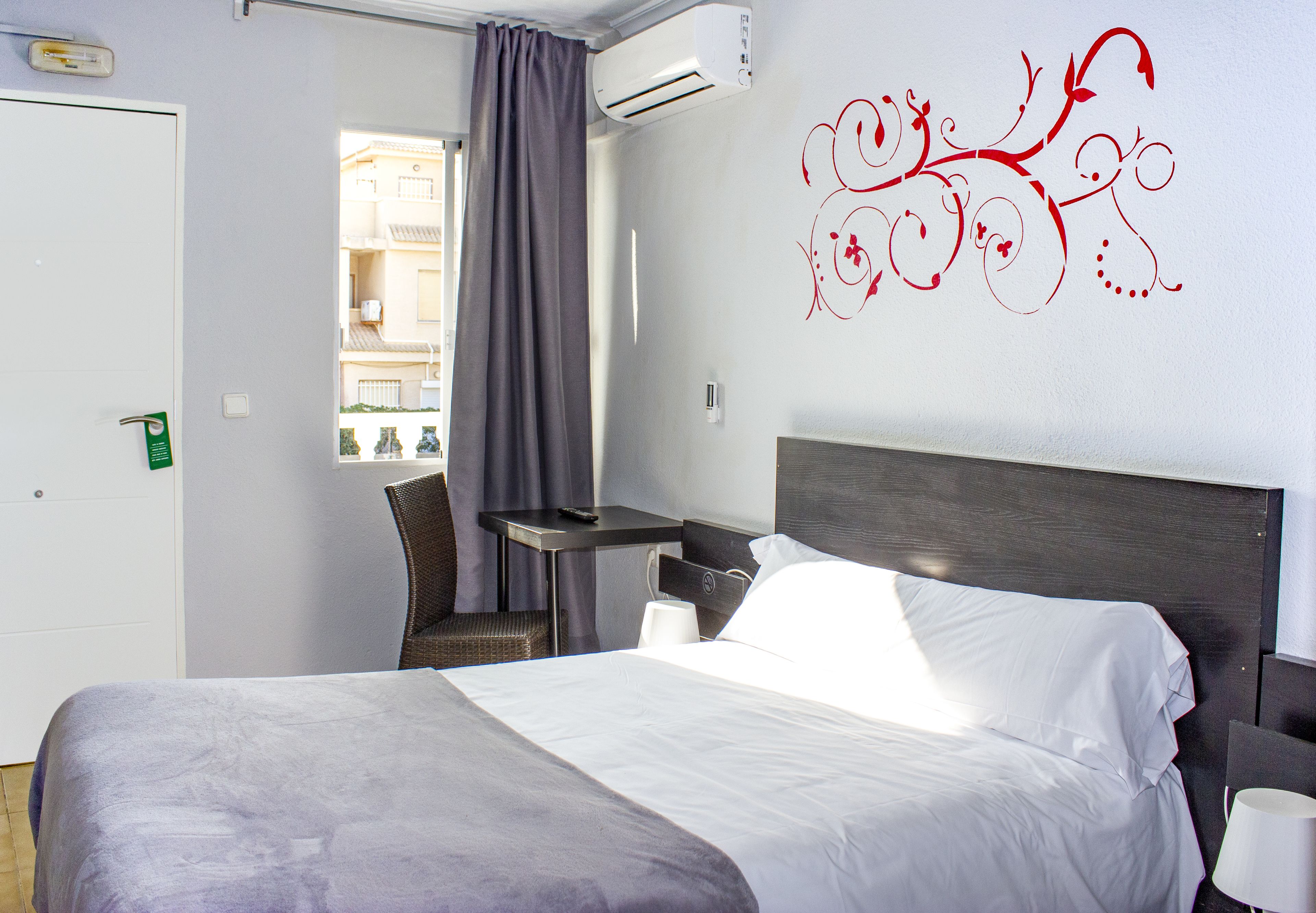 Desk, laptop workspace, blackout curtains, iron/ironing board