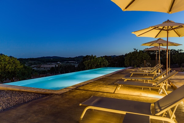 Outdoor pool, an infinity pool, sun loungers