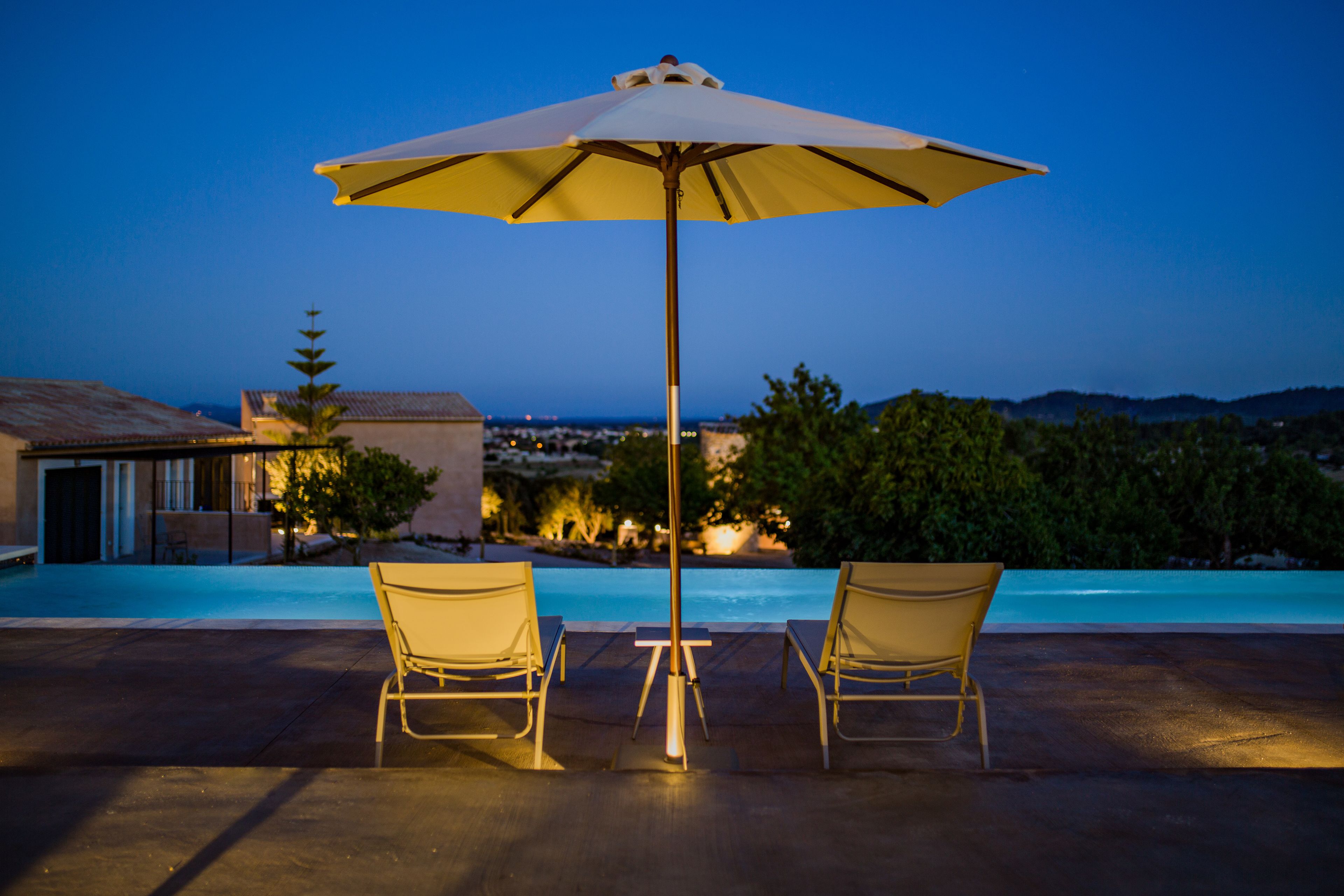 outdoor pool, an infinity pool, pool loungers