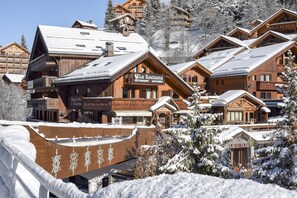 A wooden chalet-style building with a sign reading "La Kousena Restaurant Savoyard." - Hôtel L'Eterlou (Les Allues)