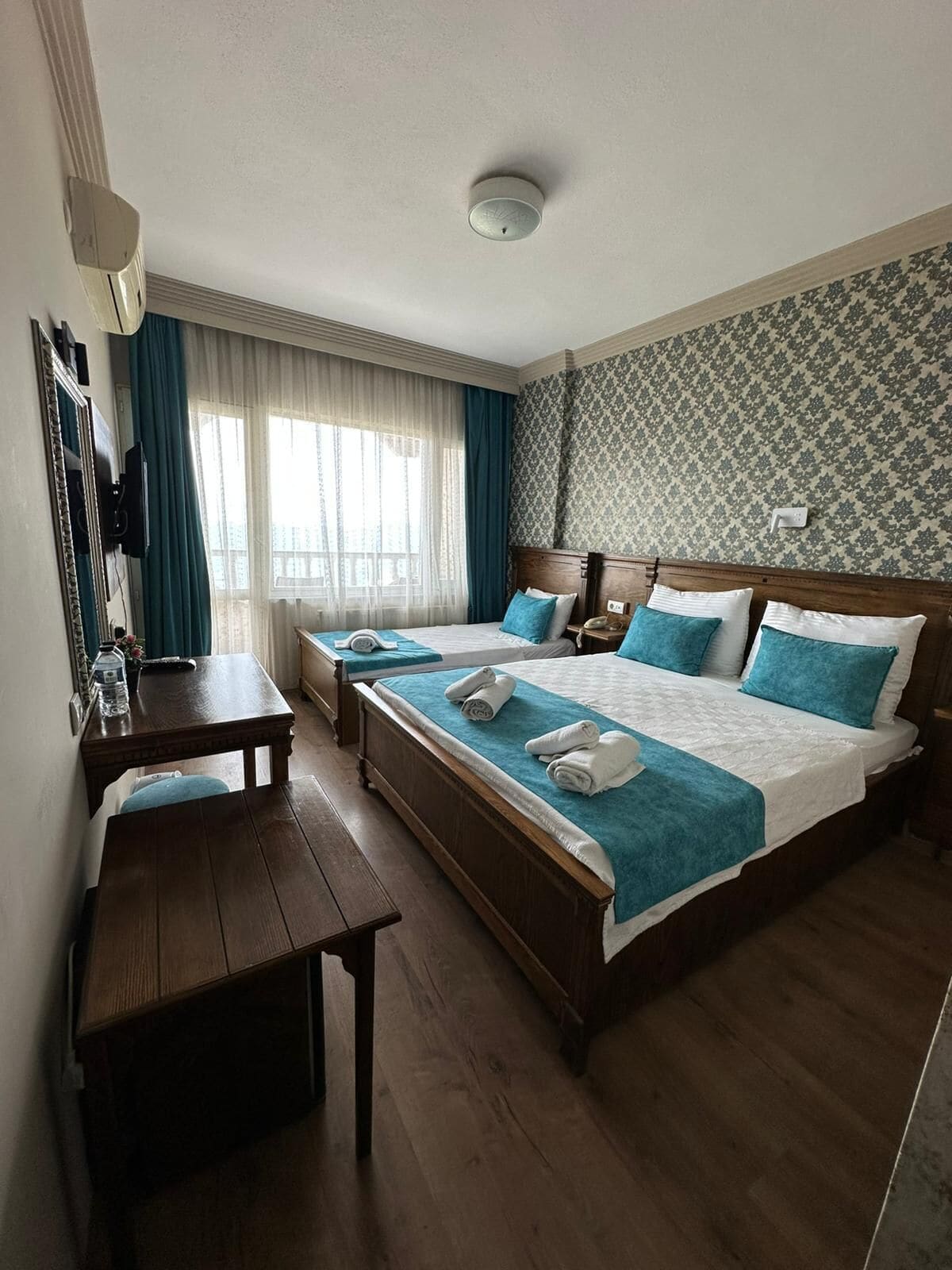 Standard Triple Room, Pool View | Minibar, in-room safe, iron/ironing board, free WiFi