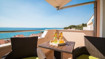 Apartment, 1 Bedroom, Sea View | Premium bedding, individually decorated, desk, iron/ironing board