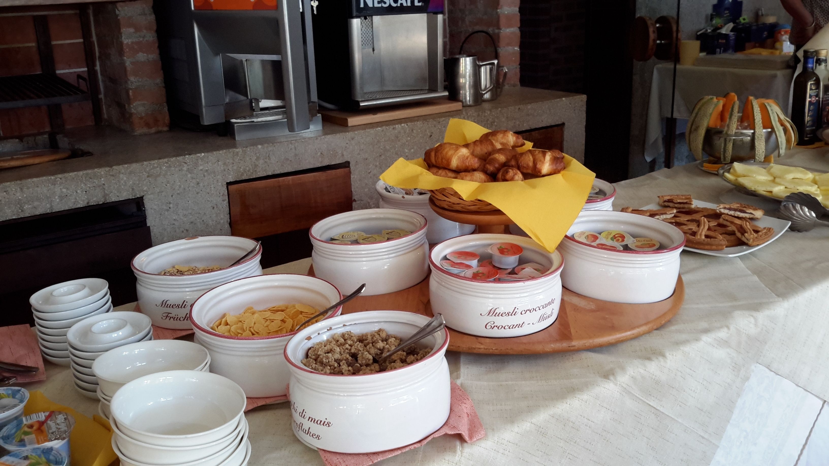 A breakfast buffet with various food items and containers.