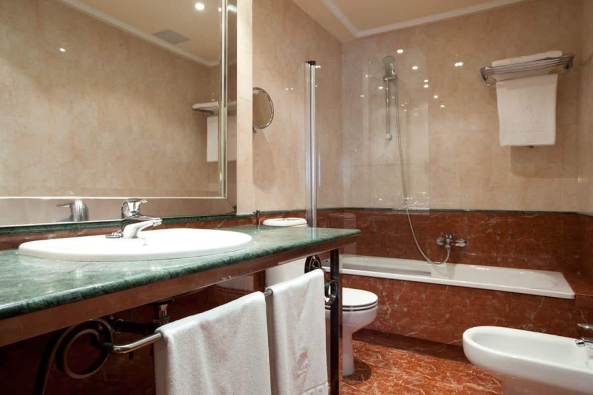 free toiletries, hair dryer, bidet, towels