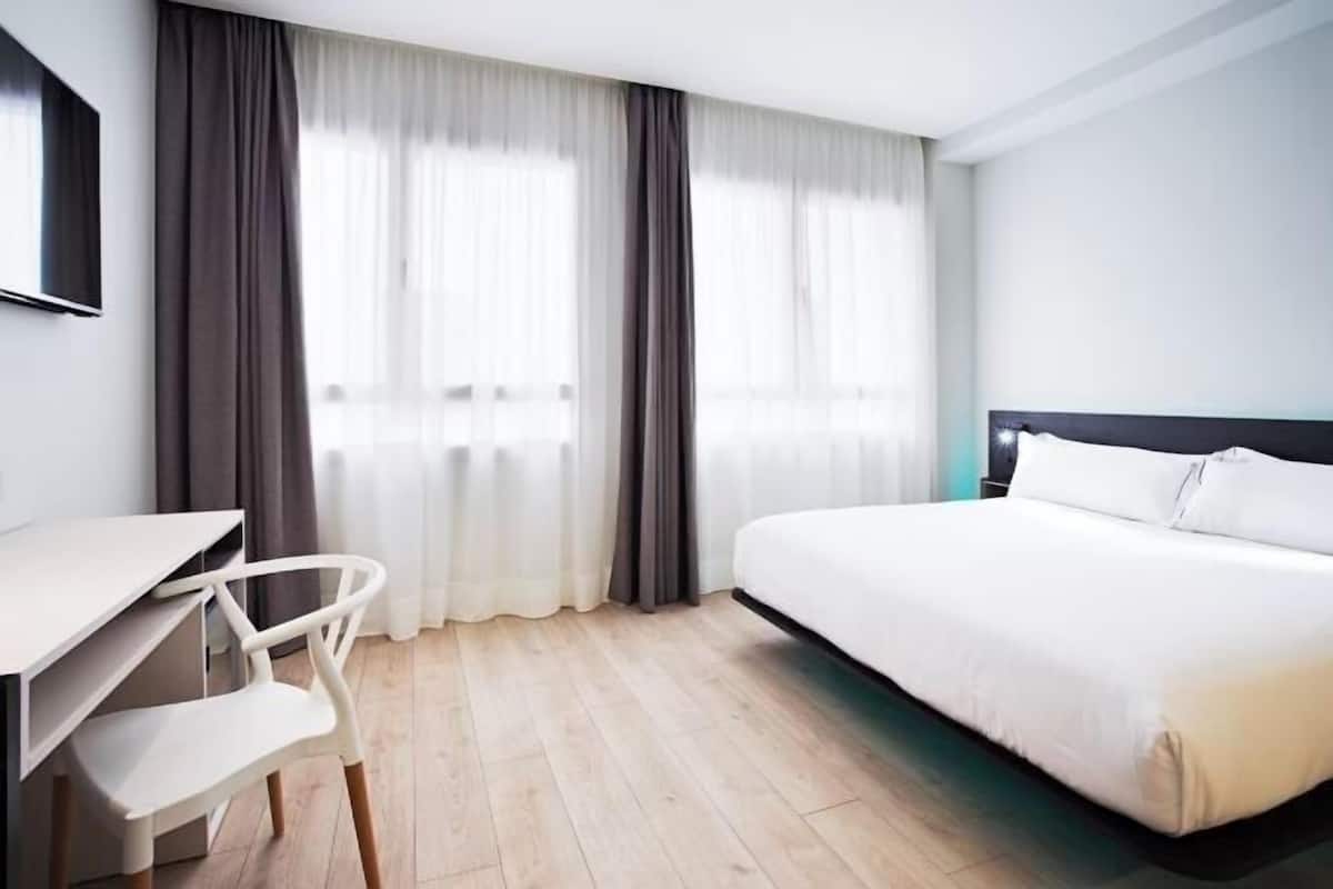 Luxe beddengoed, een minibar, een kluis op de kamer, een bureau
