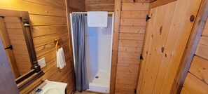 Cabin, 1 Queen Bed (Outdoorsman Cabin) | Bathroom | Shower, free toiletries, towels, soap