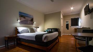 Desk, laptop workspace, blackout curtains, iron/ironing board