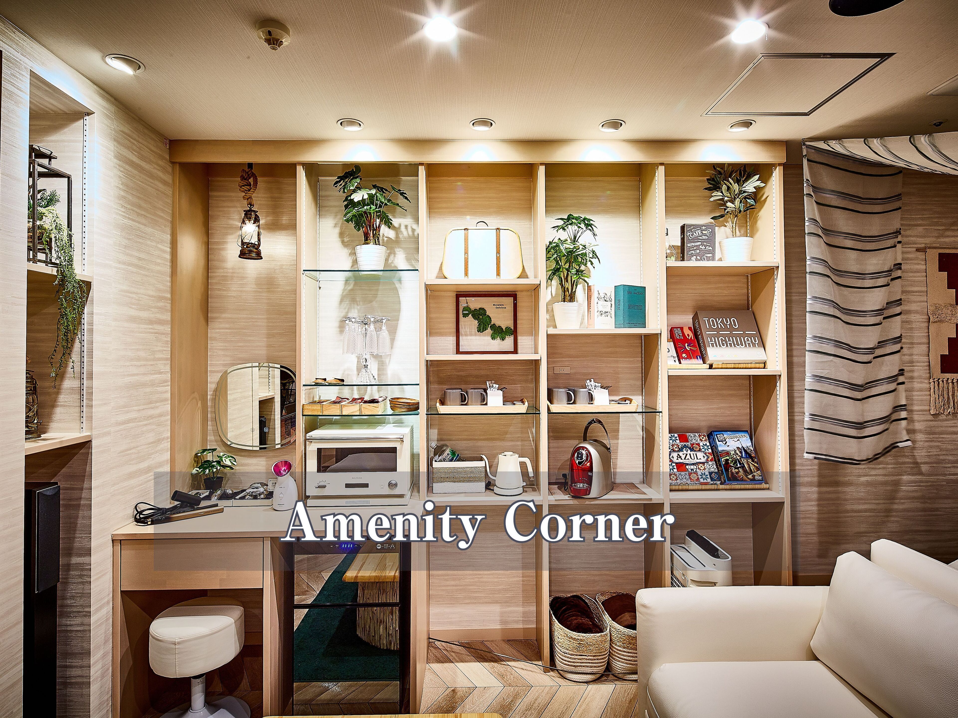 A well-organized room with a desk, shelves, and a comfortable seating area.