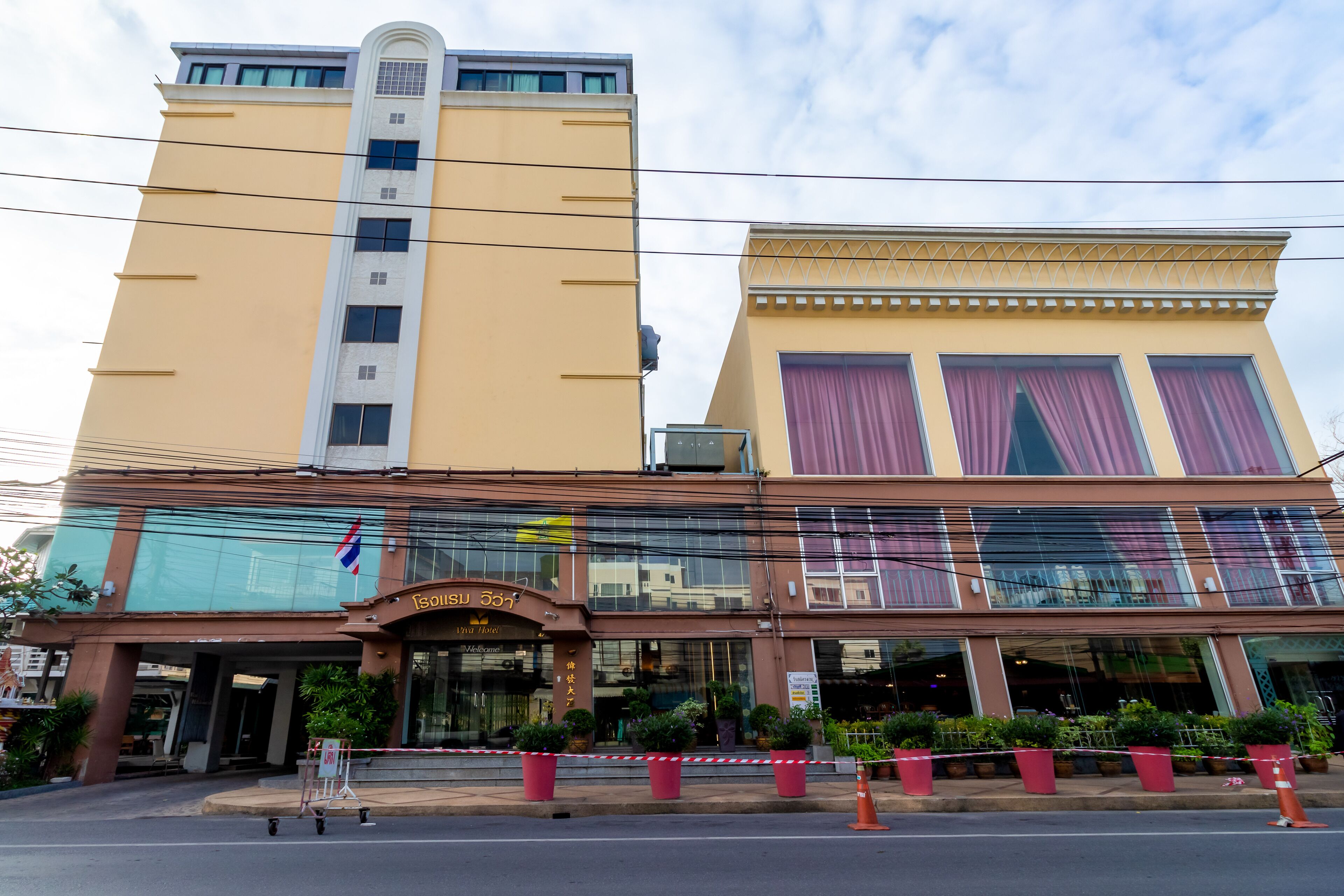 A hotel with a modern facade, large windows, and a prominent entrance.