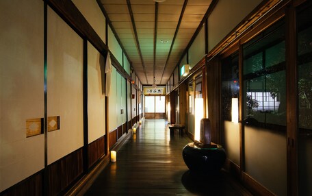 A hallway with wooden floors and traditional Japanese sliding doors.