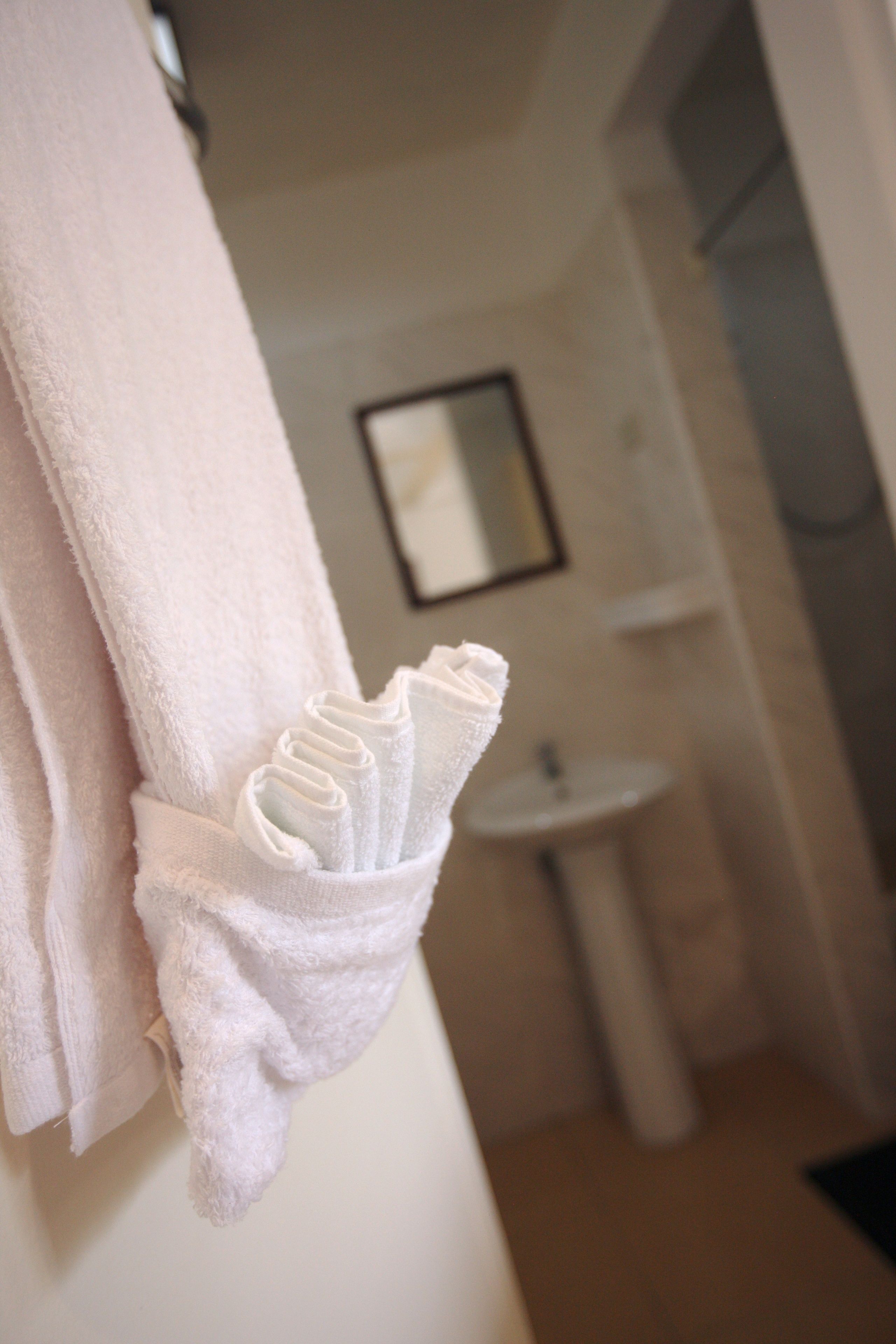 shower, free toiletries, slippers, towels