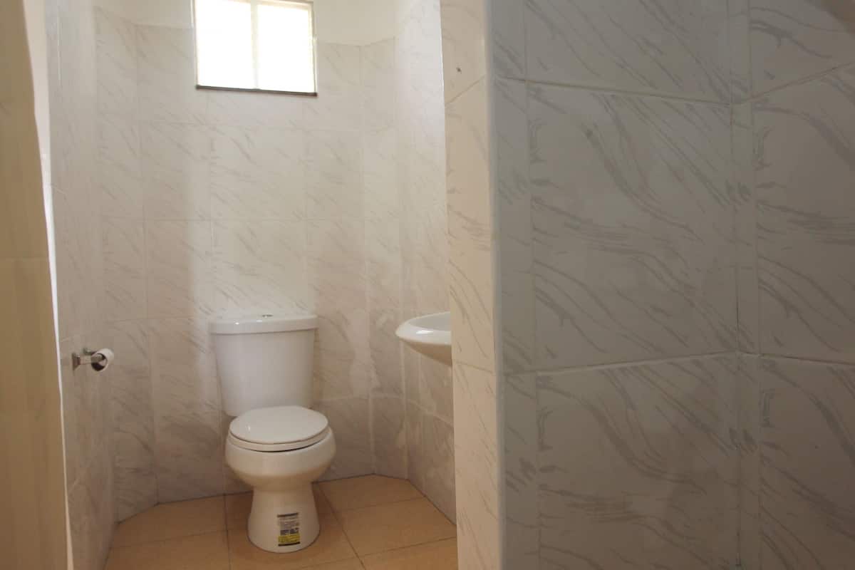shower, free toiletries, slippers, towels