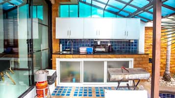 Pool Villa No. 1 | Private kitchen | Full-size fridge, microwave, stovetop, coffee/tea maker