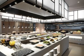 A modern buffet setup with various food stations and glassware. - Shilla Stay Seocho Gangnam Station (Seoul)