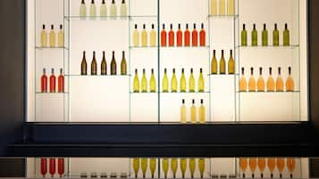 A wine display with various bottles organized on shelves.