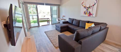 Two Bedroom Apartment (1 King + 2 Single) | Living room | Flat-screen TV