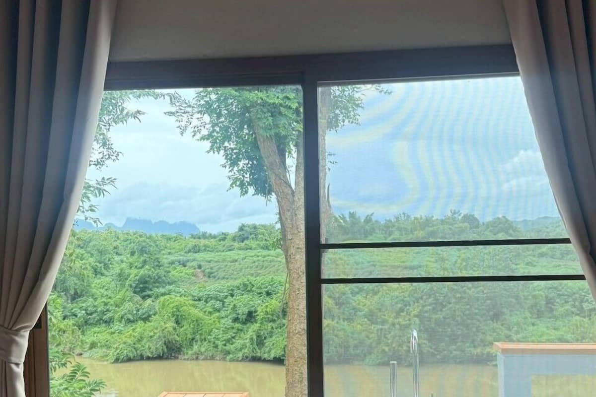 Family House, 2 Bedrooms, River View | Living area | 32-inch LED TV with cable channels, TV