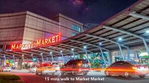 A building with a large illuminated sign reading "MARKET MARKET". - MySpace Hotel at BGC (Taguig)