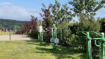 Work out under the shade of lush greenery with a variety of exercise equipment at your disposal.