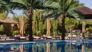 Indoor pool, seasonal outdoor pool, pool umbrellas, pool loungers