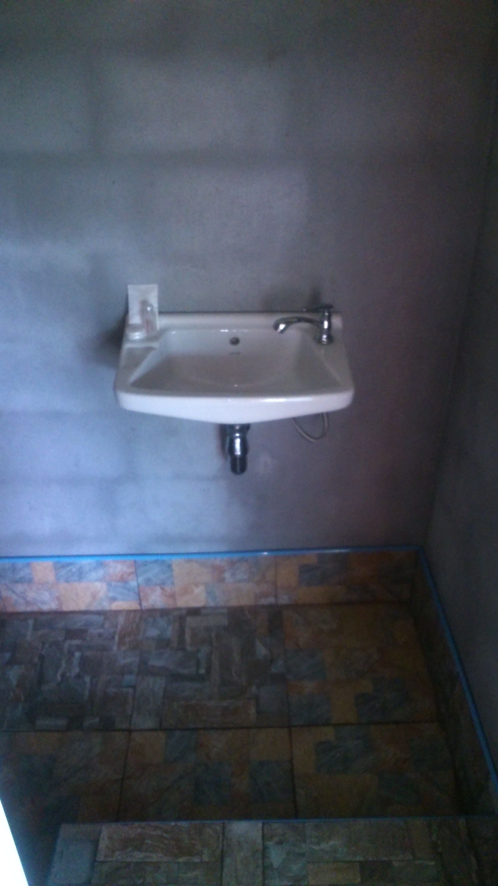 small bungalow with fan | bathroom sink