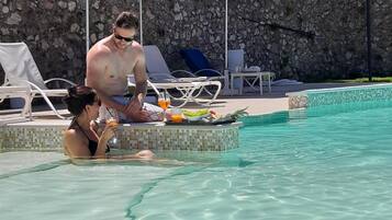 Seasonal outdoor pool, open 8:00 AM to 11:00 PM, pool umbrellas