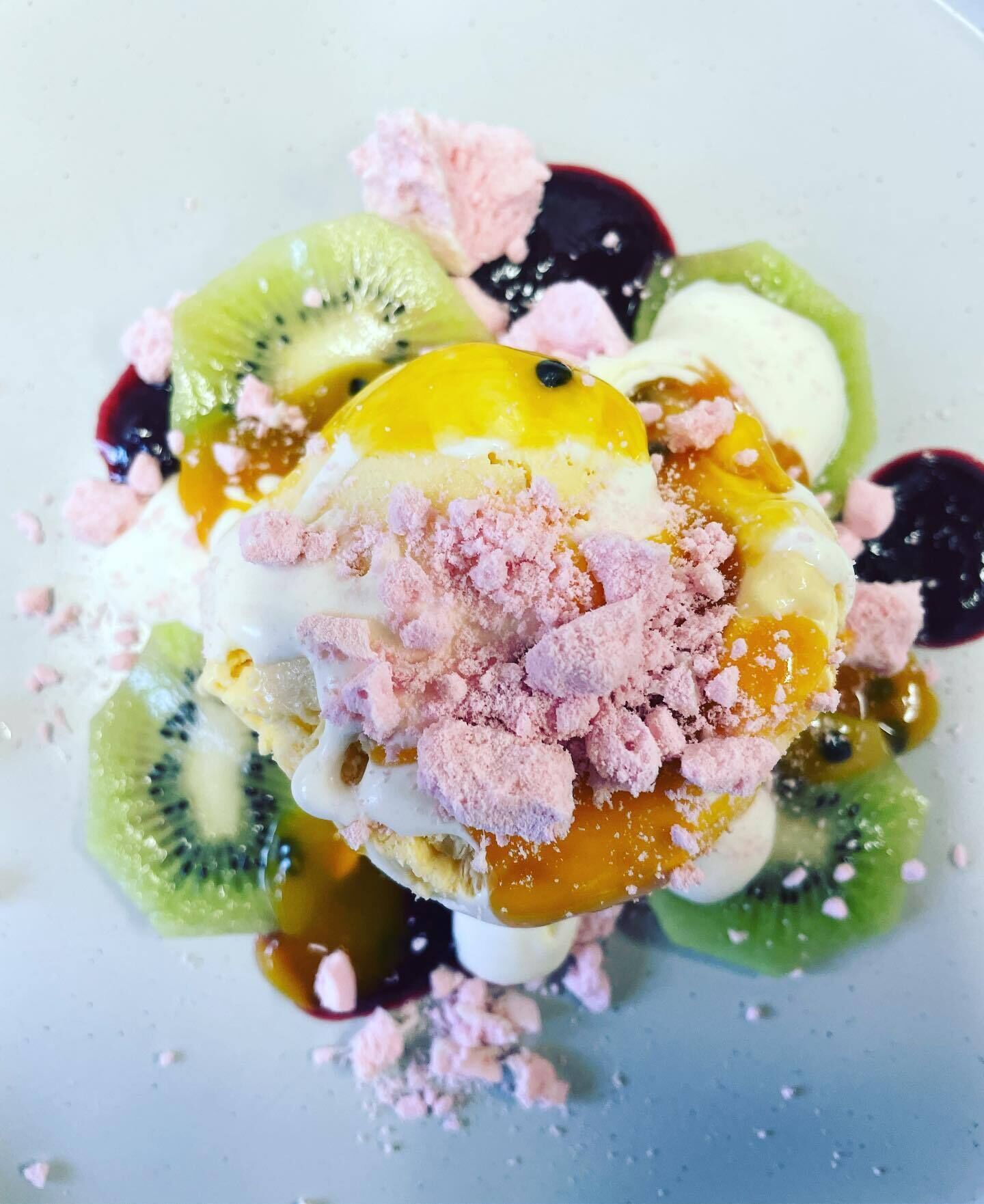 A dessert with various fruits and toppings.